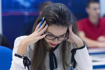 Young female student in math class overwhelmed by the math formula. Pressure, Education, Success concept.