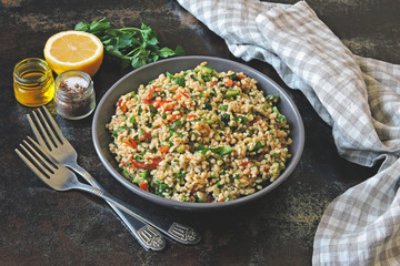 Salad tabbouleh. Healthy salad with bulgur and vegetables. Lebanese recipe. Middle Eastern cuisine.