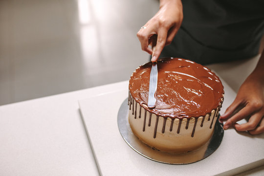 Decorating Cake With Chocolate Frosting