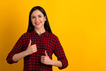 Close up photo amazing funky her she lady toothy long straight hair brown eyes show thumbs up advising good tested quality wearing red shirt clothes isolated yellow background