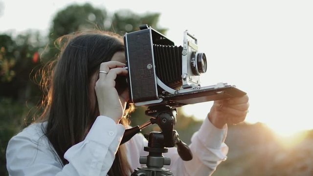 Photographer customizes large format camera before shooting