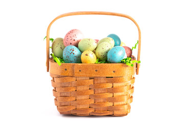 Easter Basket Filled with Decorated Eggs Isolated on a White Background
