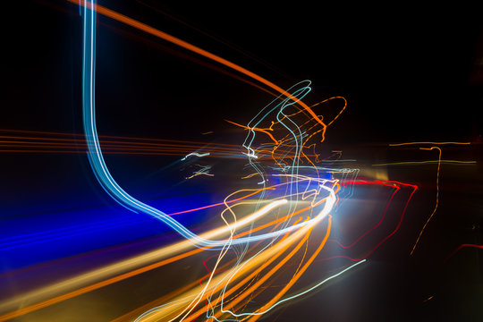 ABSTRACT IMAGE MADE WITH LIGHT PAINTING TECHNIQUE OF PREDOMINANTLY WARM COLOR