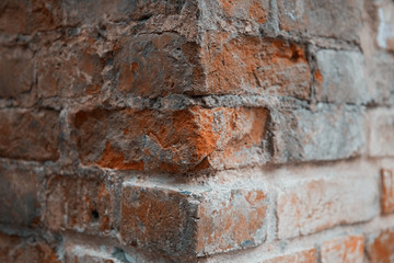 Fragment of a textured old brick wall in a loft style