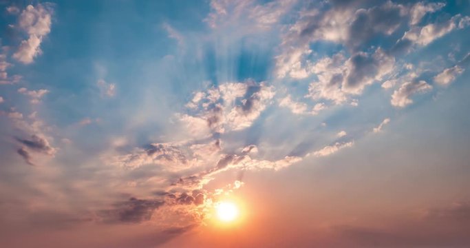 Time lapse clip of evening fluffy curly rolling altocumulus altostratus clouds with setting sun. Good windy weather