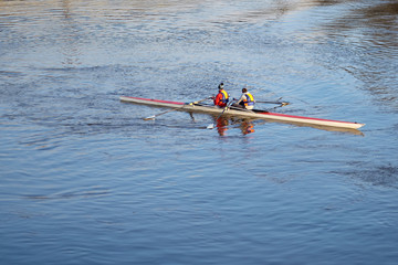 Rowing crew. Double scull rowing boat. Two rowers