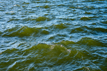 Waving clear blue sea water as a natural background.
