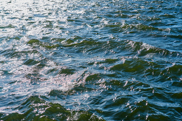 Waves on a sea water in sunlight as a natural background.