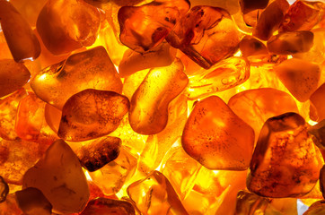 closeup from little amber stones backlight - background