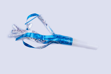 Party whistle for Birthday celebration. Blue Birthday whistle isolated on a white background.