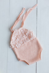 suit for newborns. peach bodysuit for baby. suit for girls