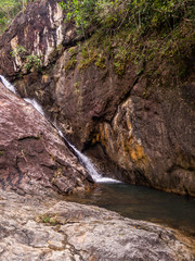 Water flows over the rocks of the waterfall on Koh Phangan. Thailand