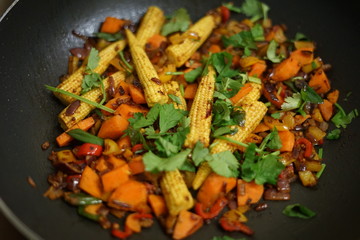 cooking vegetables in a wok