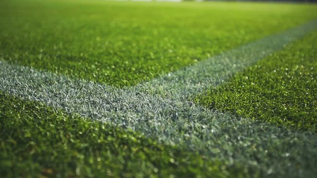 Close up boundary line on a turf football field.