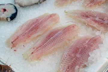 pollock fillet on ice. Fillet of sea fish on ice on the counter of the fish market in Athens, Greece.