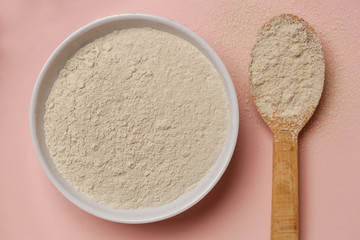 Top view of cosmetic clay powder in a bowl 