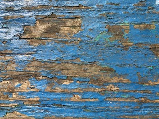 Blue paint peeling off old wood