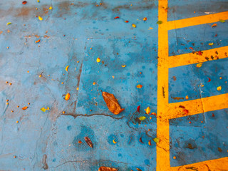 Blue parking floor with flashy yellow lines