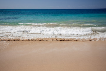 Fototapeta na wymiar Waves and Sand