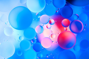 water drops on glass with blue background, close-up 