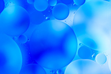 water drops on glass with blue background, close-up 