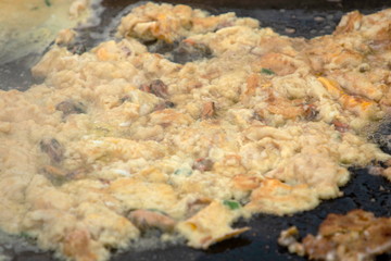 Hoi Tod or Thai Style Crispy Fried Oysters and  Mussel Pancakes , Hot Pan Seafood .