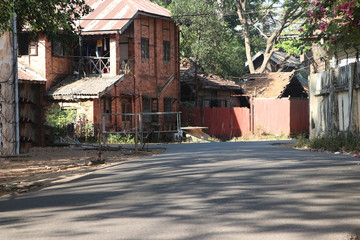 Alleyway and old style of house in the middle of Yangon City.