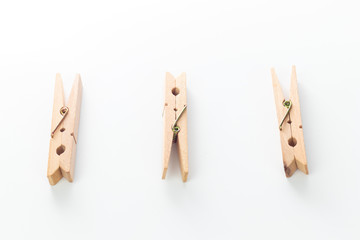Wood clothespins isolated on white background object concept