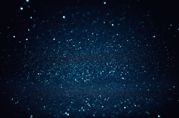 glitter vintage lights background. black and blue. de-focused