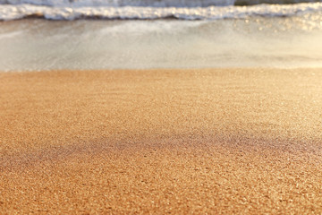 Fototapeta na wymiar background image of sandy beach and ocean waves