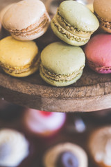 Colorful macarons on a wood stand