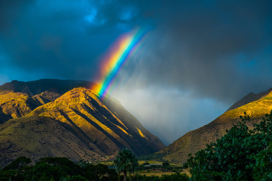 Bright rainbow over the mountains. Maui, Hawaii