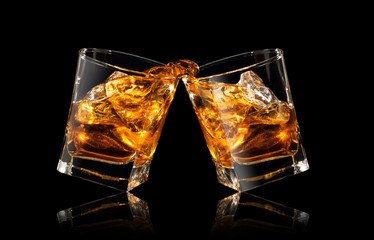 glasses of whiskey making toast