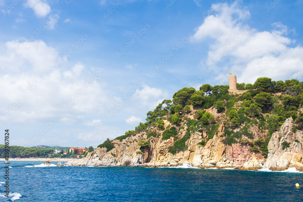 Wall mural sea coast landscape in lloret de mar with old tower castle on rocky shore, costa brava, spain - Wall murals