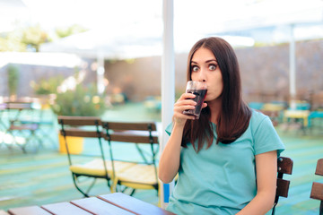 Woman Drinking a Glass of Soda in Summer Time