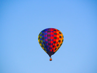 Fototapeta na wymiar Colorful Hot Air Balloon Floating Blue Sky
