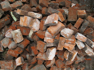 Red brick fragments scattered on the ground