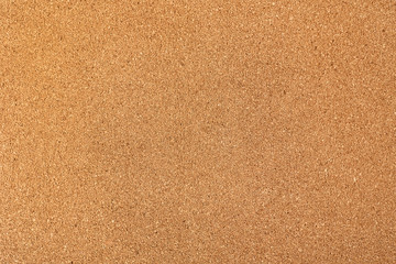 Fototapeta na wymiar Background of brown cork board texture, close up