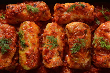 Cabbage rolls with chicken meat and rice in tomato sauce. Stuffed cabbage leaves. Delicious dinner 