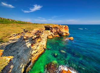 Beautiful landscape with rocky shore and blue sea