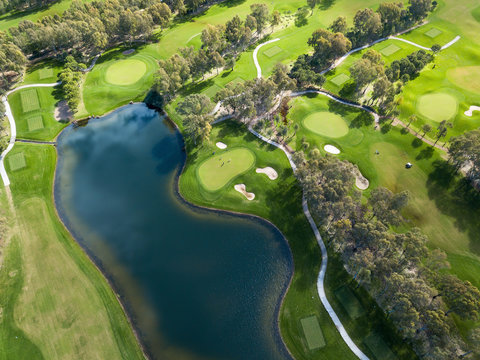 Aerial photo of green golf fields in spring