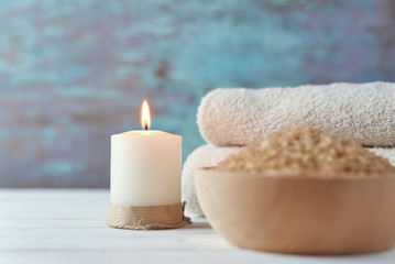 Fototapeta na wymiar Towels, candle and spa salt close up