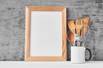 Kitchen utensils and white blank with copy space
