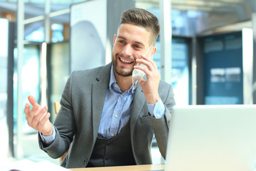 Transparent phones of the future concept, a Caucasian businessman having call with his friend.