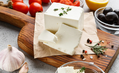 Cubes of feta and spices on board