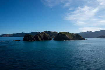 Fototapeta na wymiar Marlborough Sounds in New Zealand on a clear sunny day - view from the ferry crossing between Wellington and Picton