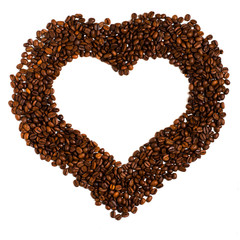 Roasted coffee beans on white background. Space for text in the shape of a heart. The concept - a love for coffee