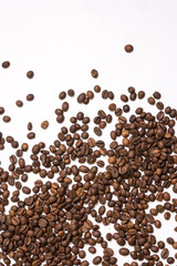 Roasted coffee beans in bulk on a light blue background. dark cofee roasted grain flavor aroma cafe, natural coffe shop background, top view from above, copy space