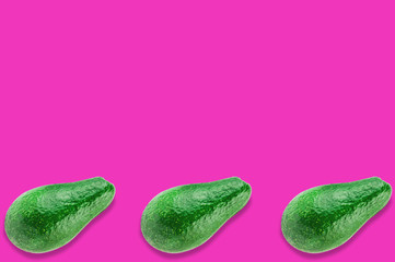 Row of three green whole fresh raw avocados on pink background with copy space for your text