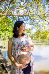 Pregnant beautiful women recreation in city public park